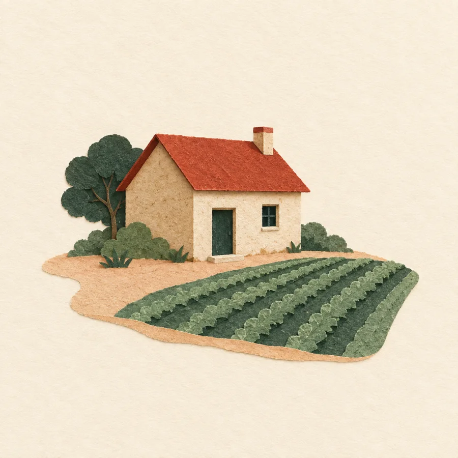 Ein Bauernhaus neben einem Feld