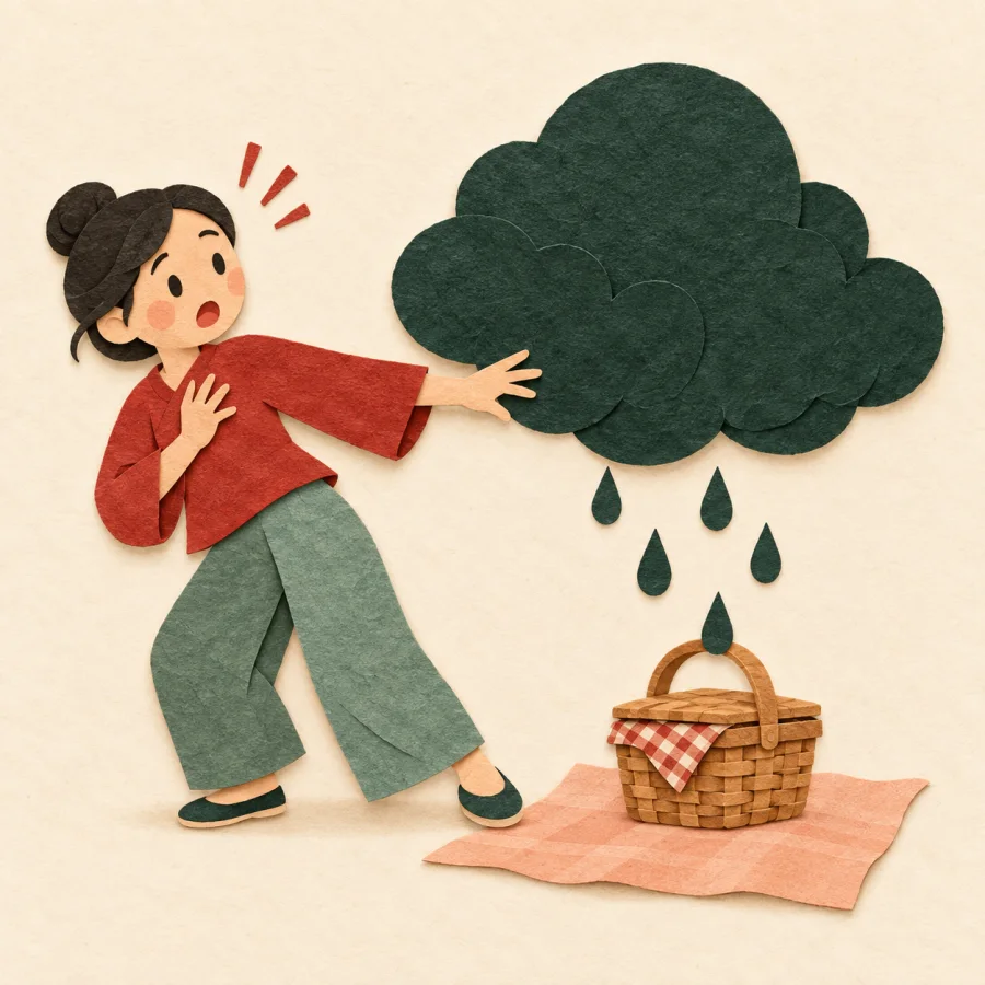 A person reaching toward a picnic basket