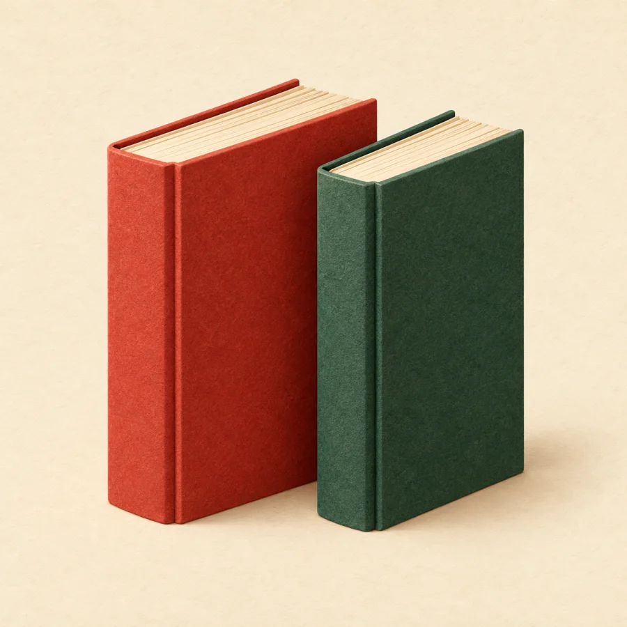 Two similar books side by side, one red and one green
