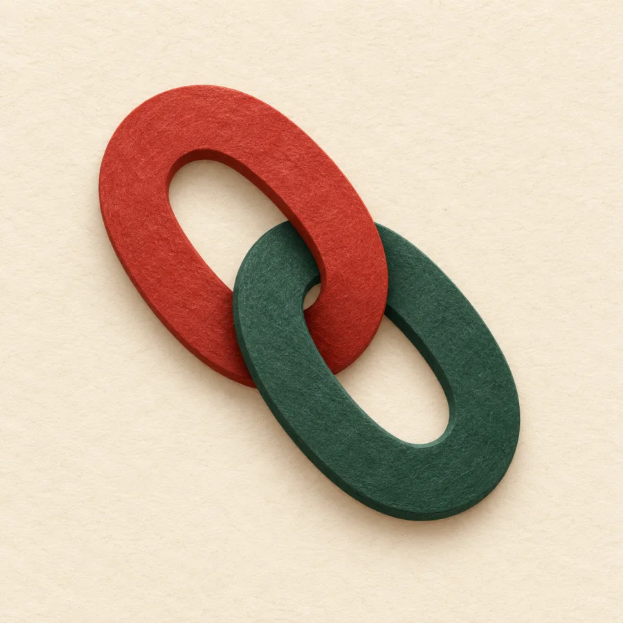 Two linked chain links, one red and one green