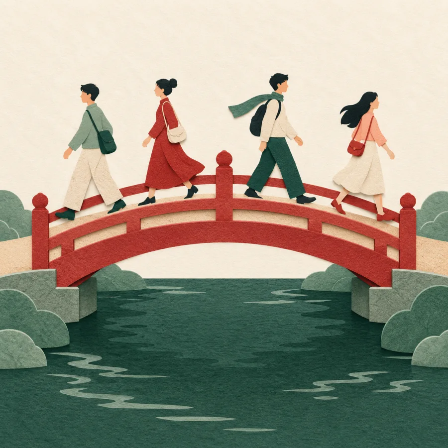 People walk in both directions across an arched bridge