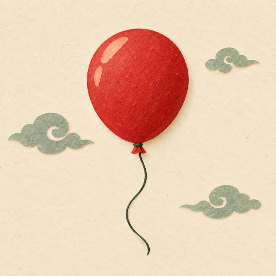 A red balloon floats upward among light clouds