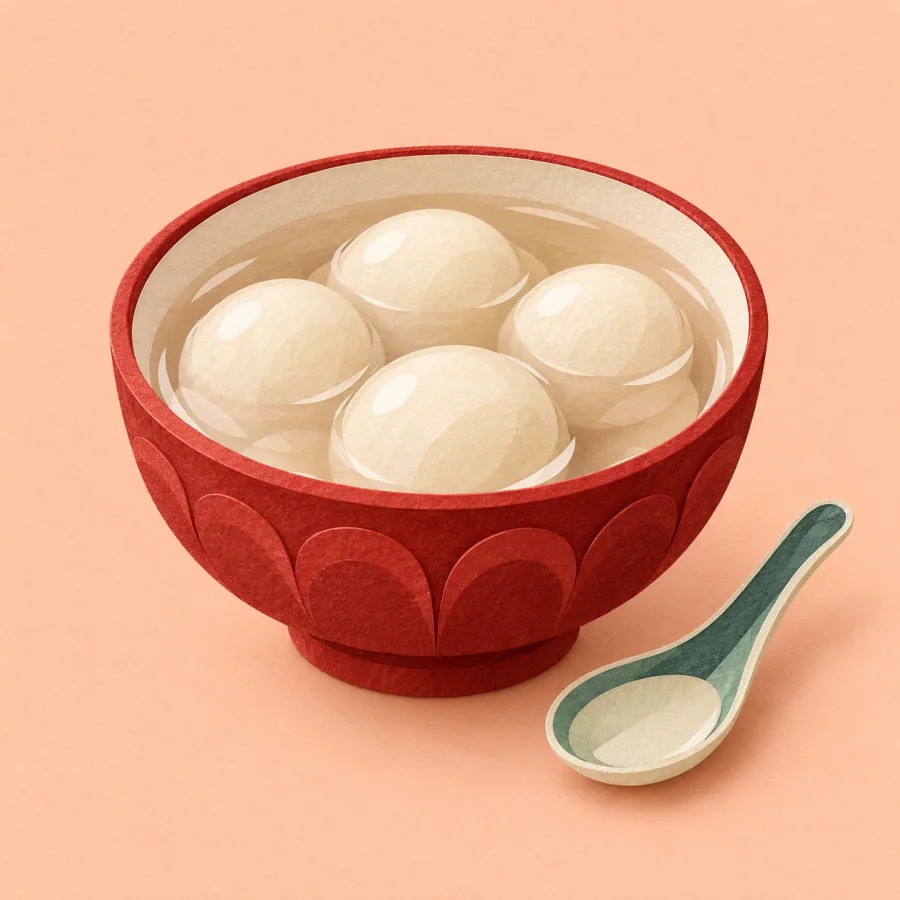 A red bowl of round white dumplings in soup