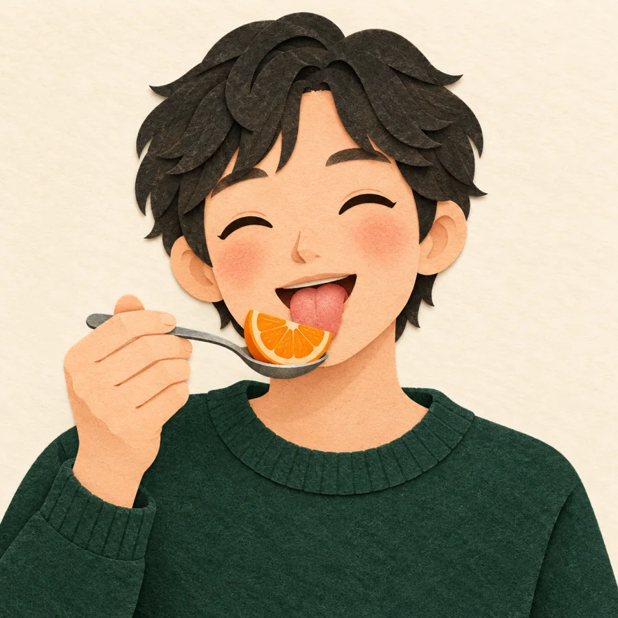 A person tastes an orange slice from a spoon