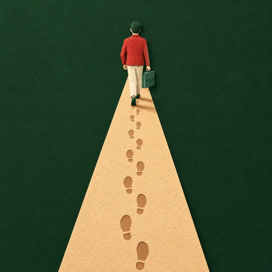A person with a briefcase walks a straight path with footprints