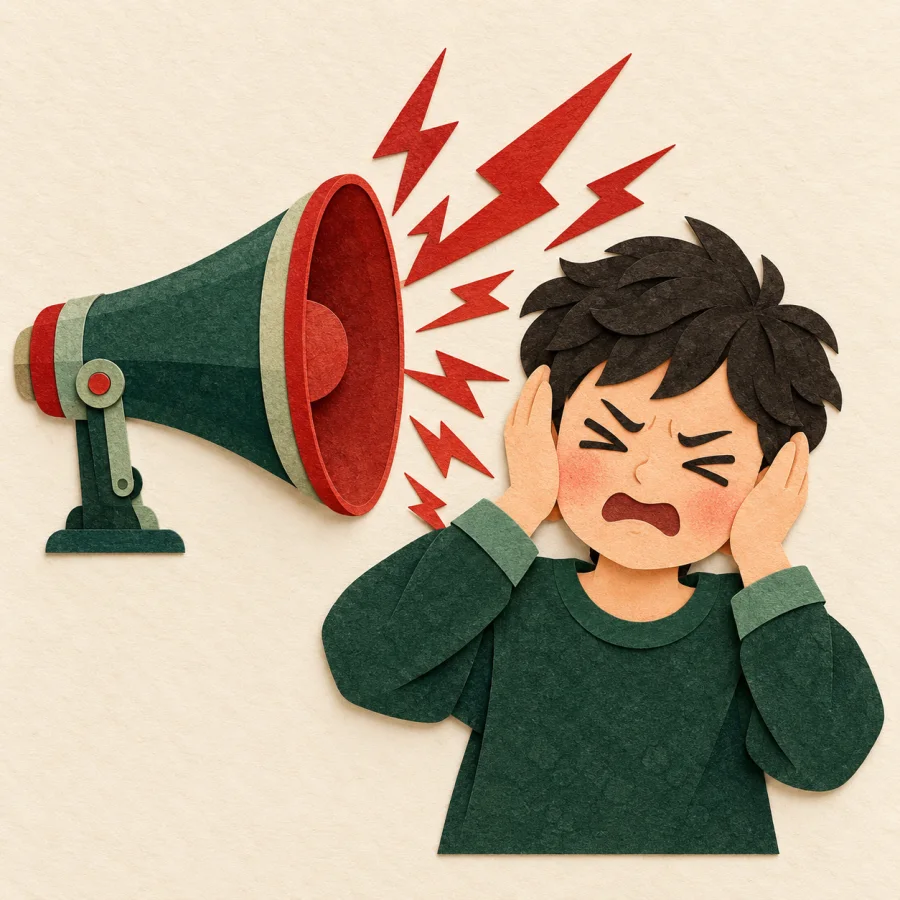 A person covers both ears beside a loud megaphone