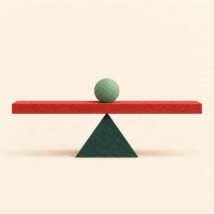 A ruler balances on one finger