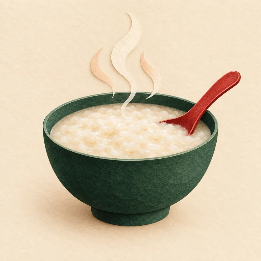 A bowl of hot porridge with steam