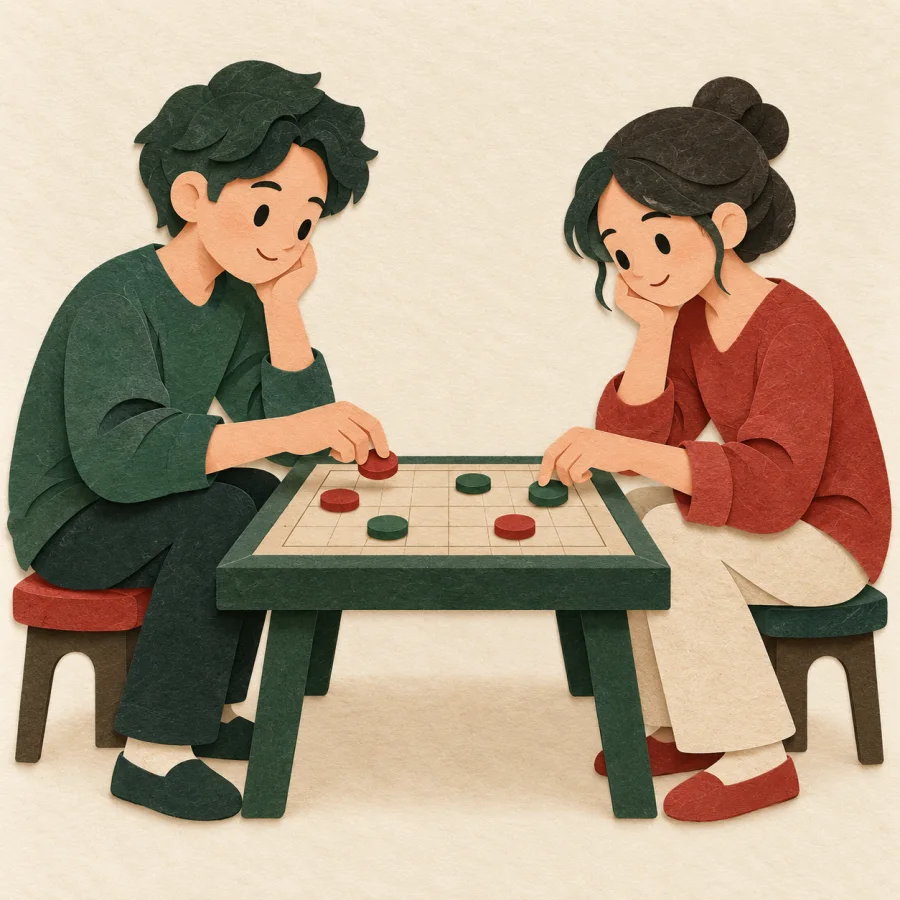 Two people play a board game with red and green pieces