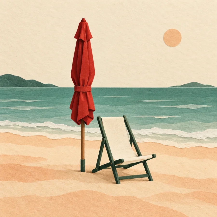 An empty beach with one folded umbrella and a deck chair