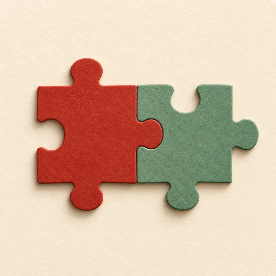 A red and a green puzzle piece fit together