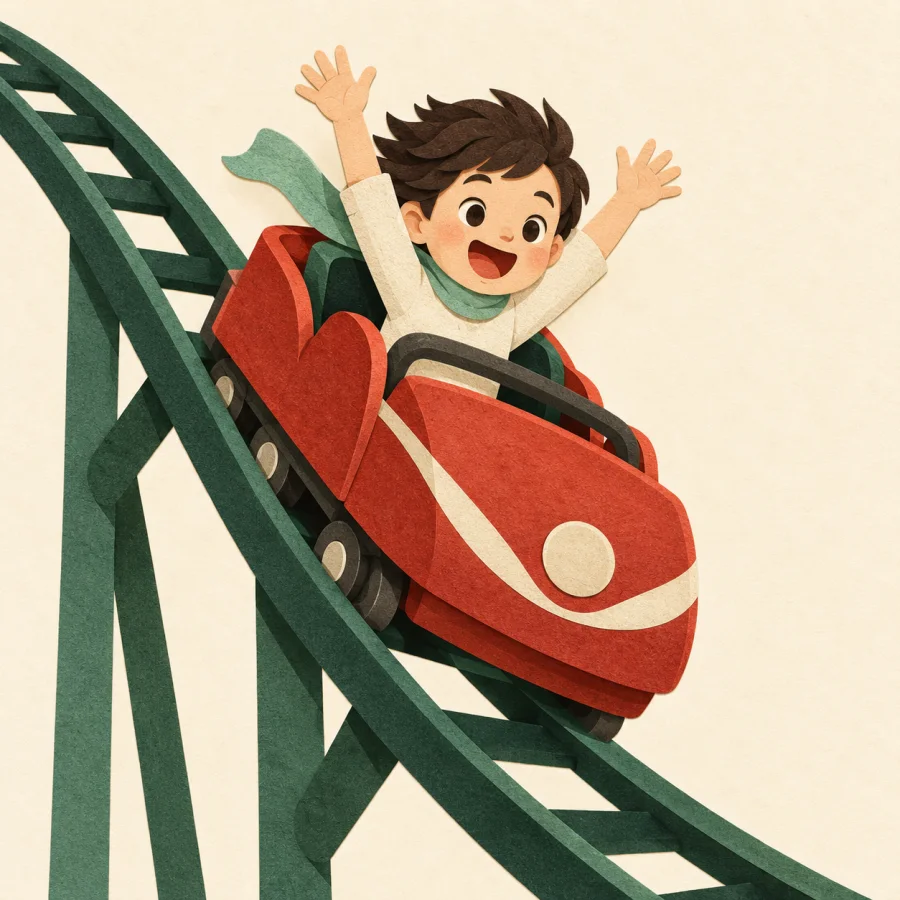 A rider with raised arms in a coaster car on a steep drop