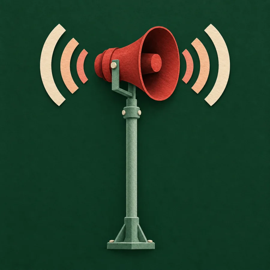 A red siren on a pole sends out sound waves