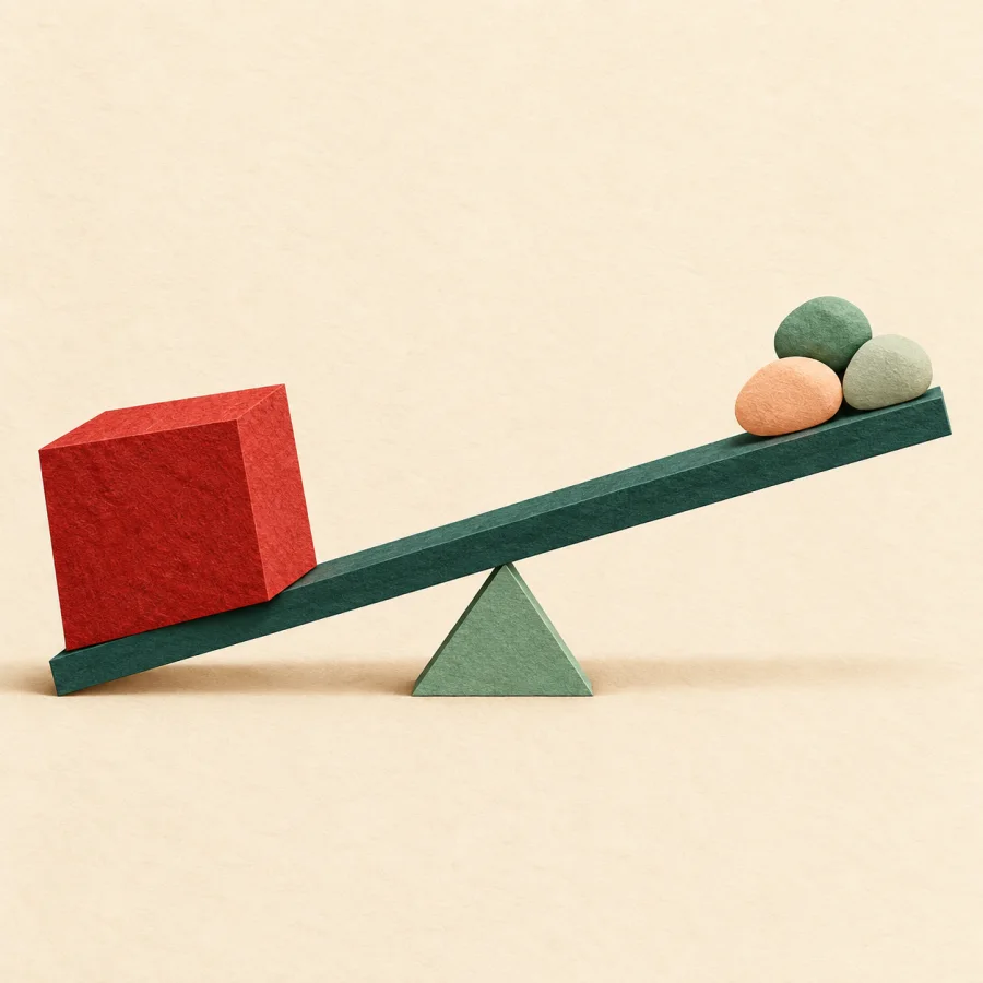 One large red block outweighs small pebbles on a seesaw