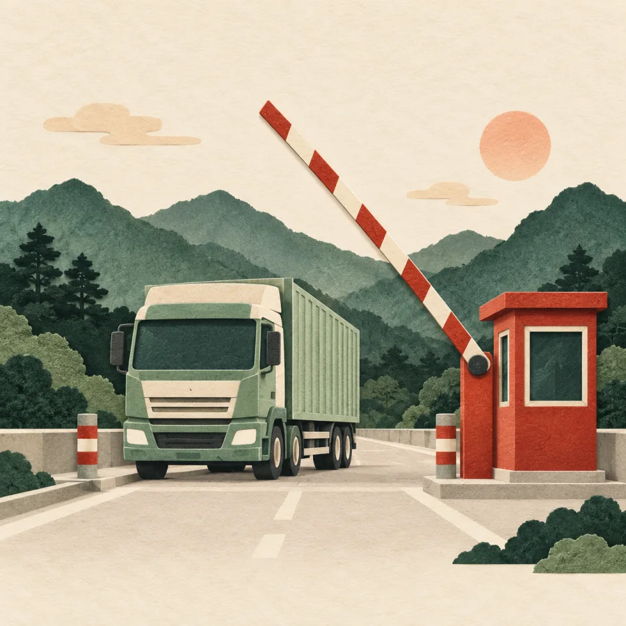A border barrier with a cargo truck waiting
