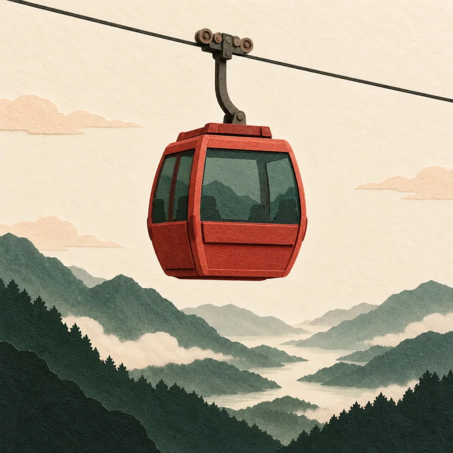A red cable car cabin over a green slope