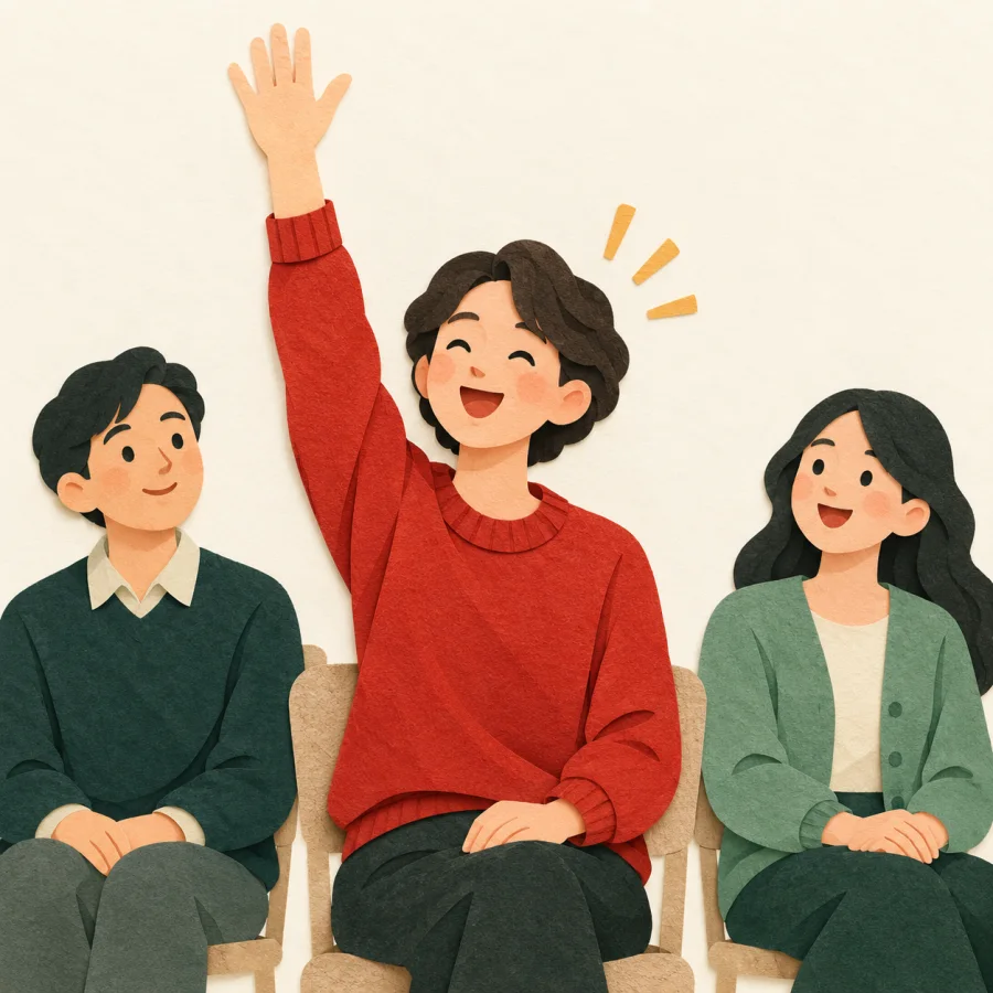 A smiling person eagerly raises a hand to volunteer