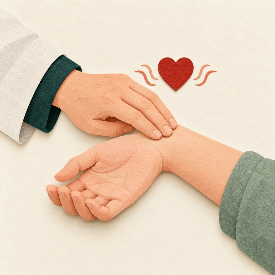A doctor's hand on a patient's wrist