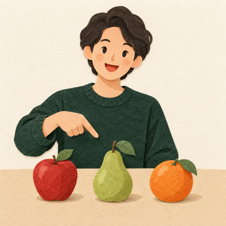 A teacher points at an apple, a pear and an orange in a row