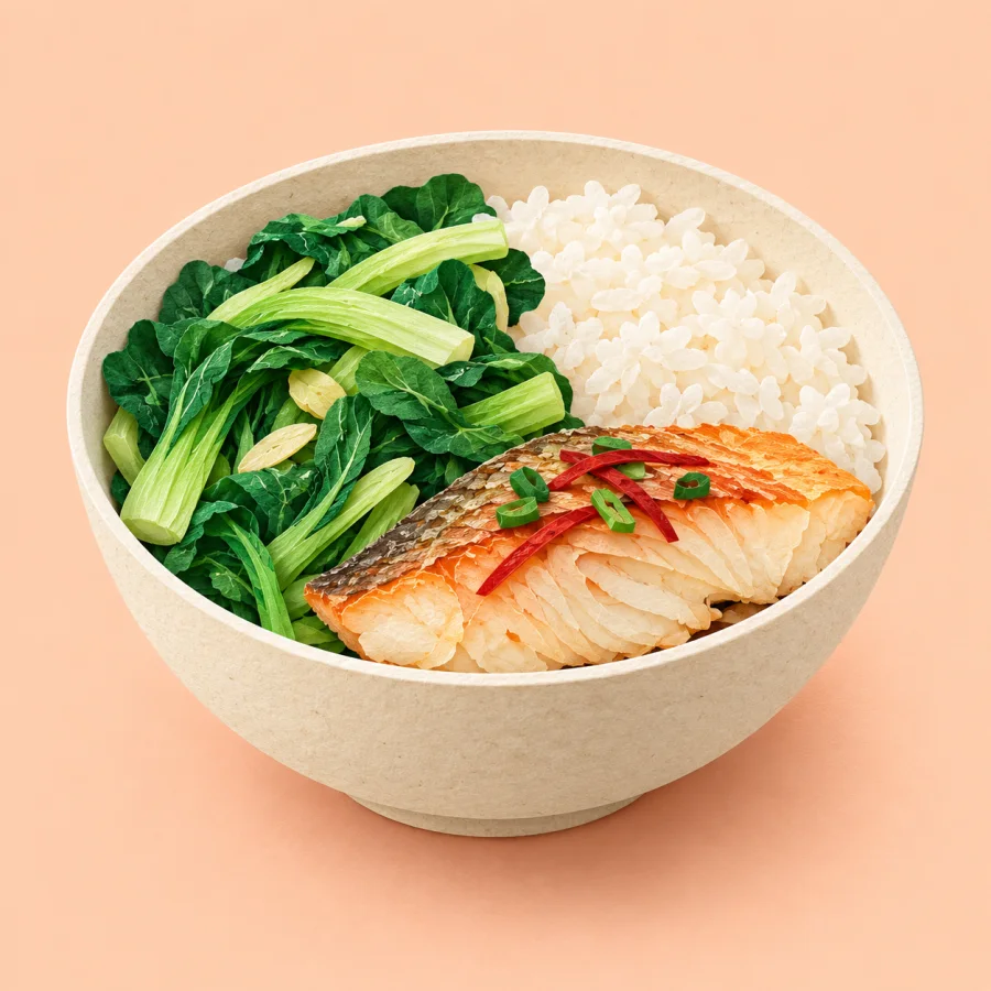 A balanced meal plate with rice, fish and green vegetables